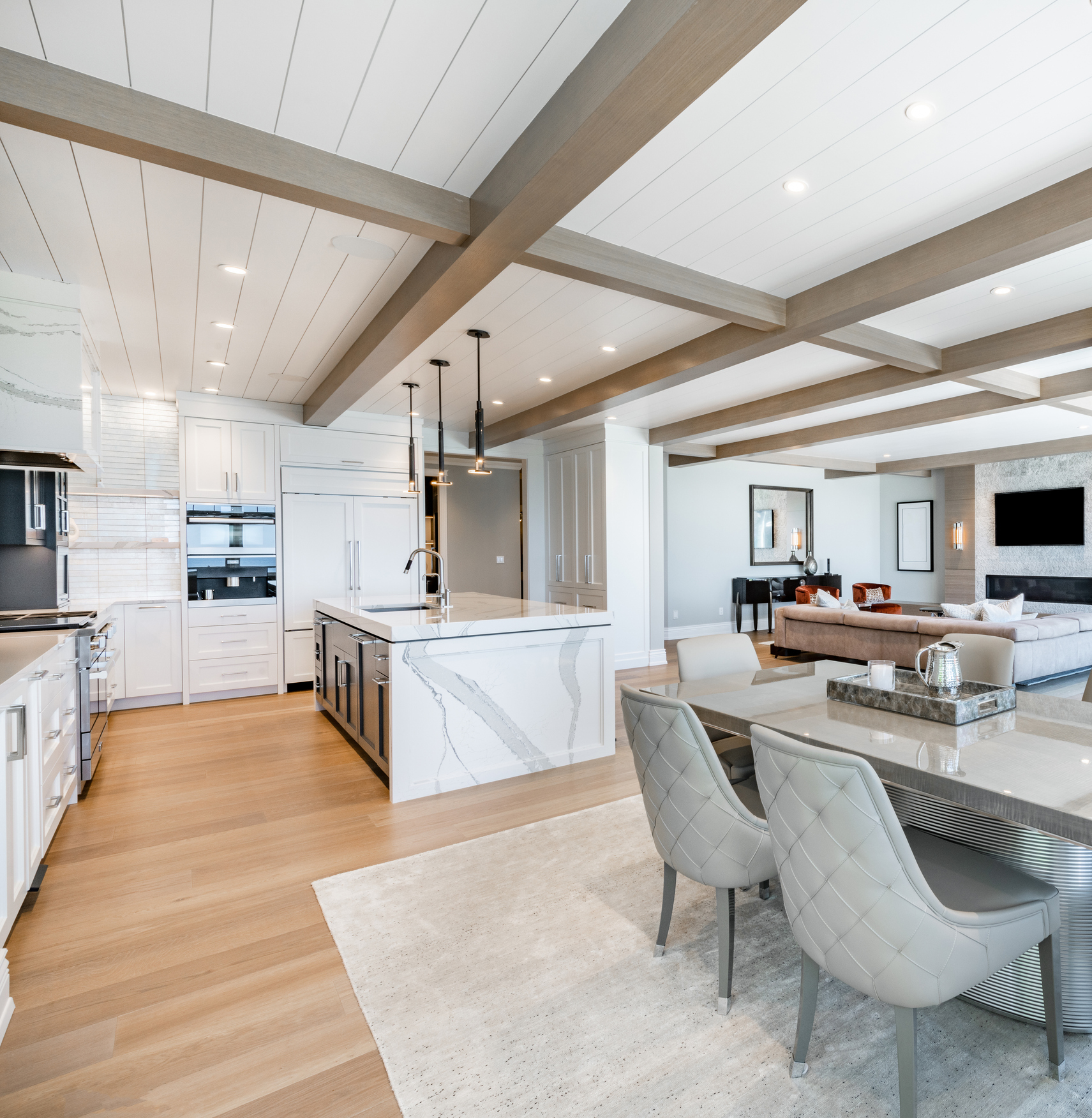 Open plan kitchen and dining with beamed ceiling