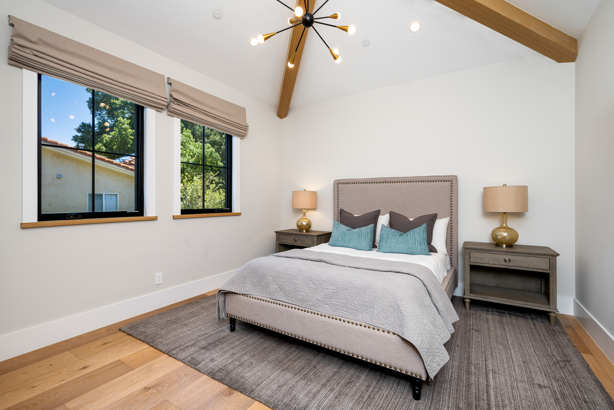 Bedroom renovation with exposed beam and modern fixtures