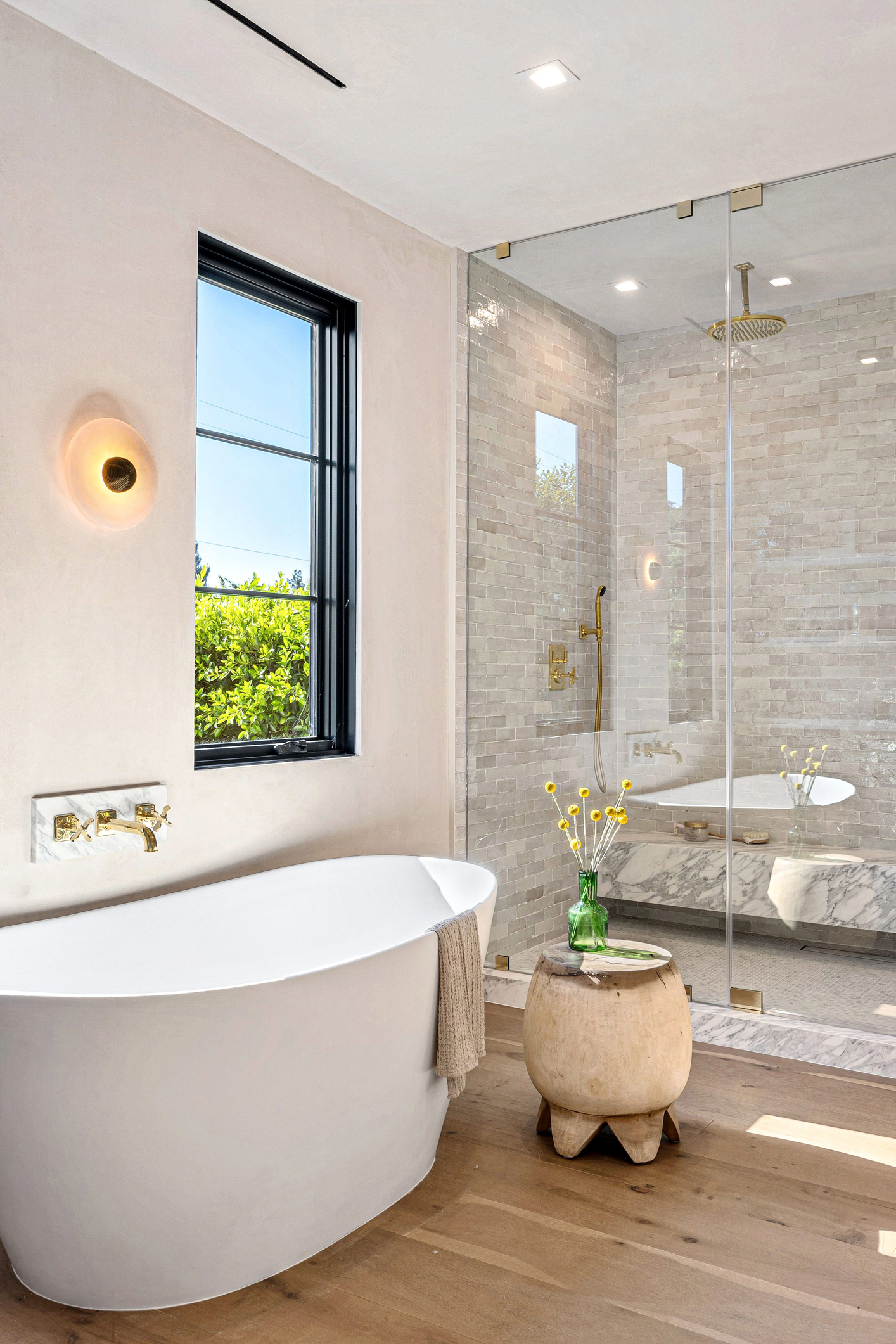 Luxury bathroom with soaking tub and walk-in glass shower