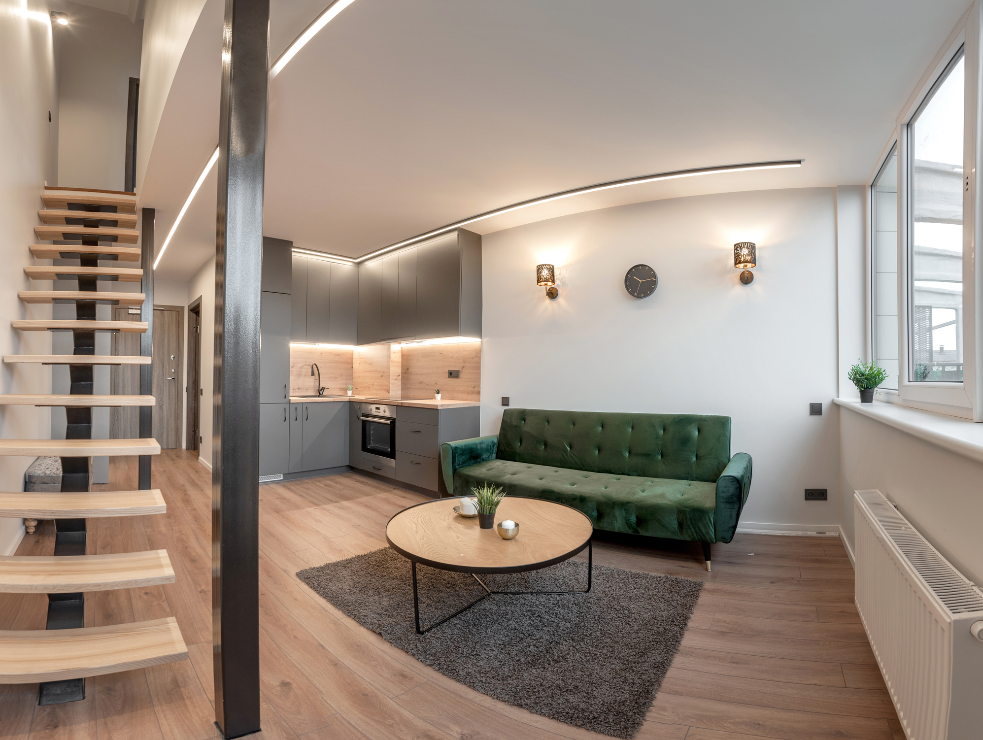 Modern loft apartment with open staircase and living area