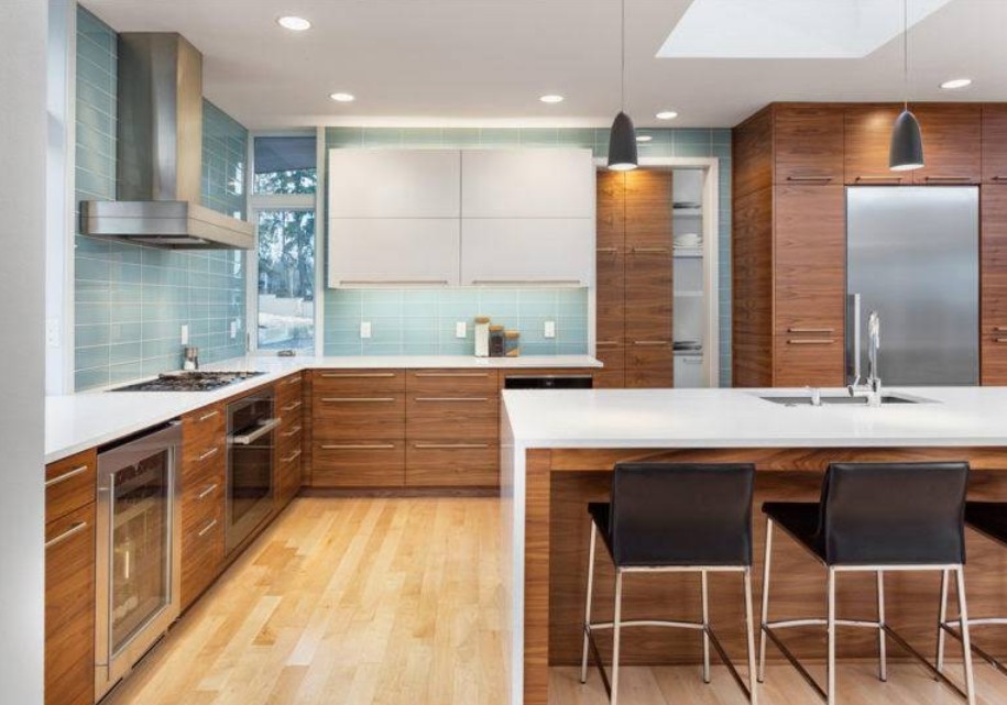 Mid-century modern kitchen with blue tile and walnut cabinets