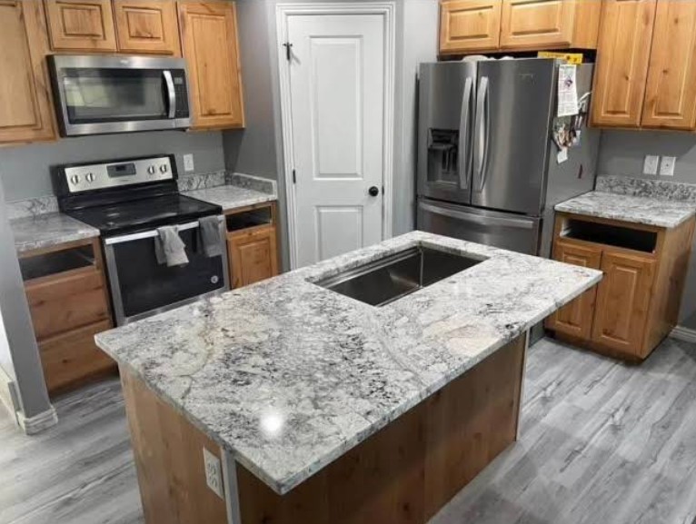 Kitchen remodel with granite countertops and wood cabinetry